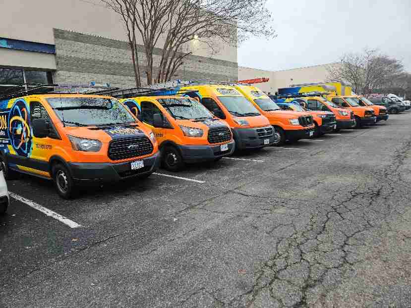 Row of Fusion company vehicles