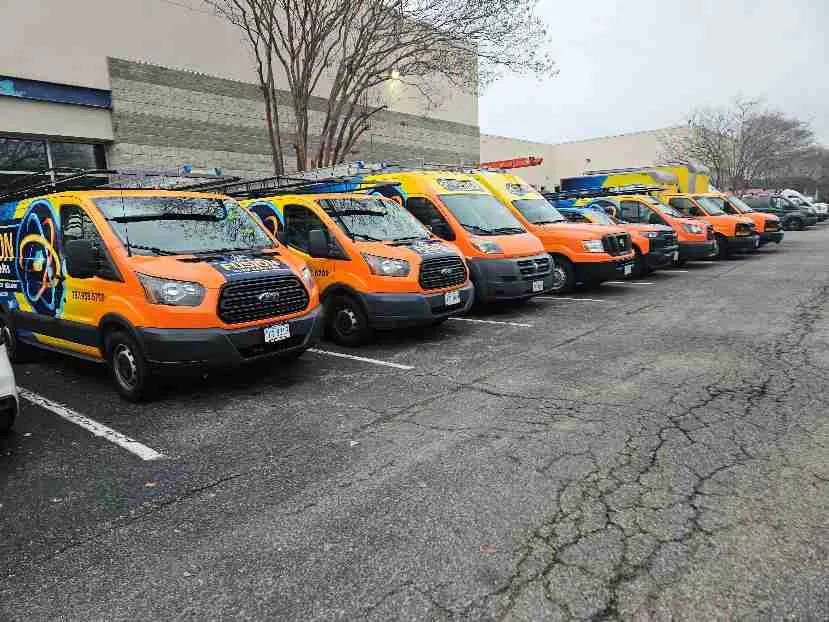 Row of Fusion company vehicles