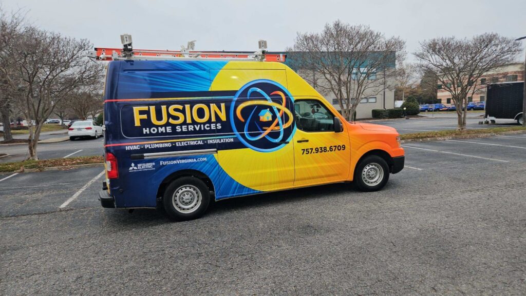 Fusion HVAC & Insulation service van in parking lot with company branding.